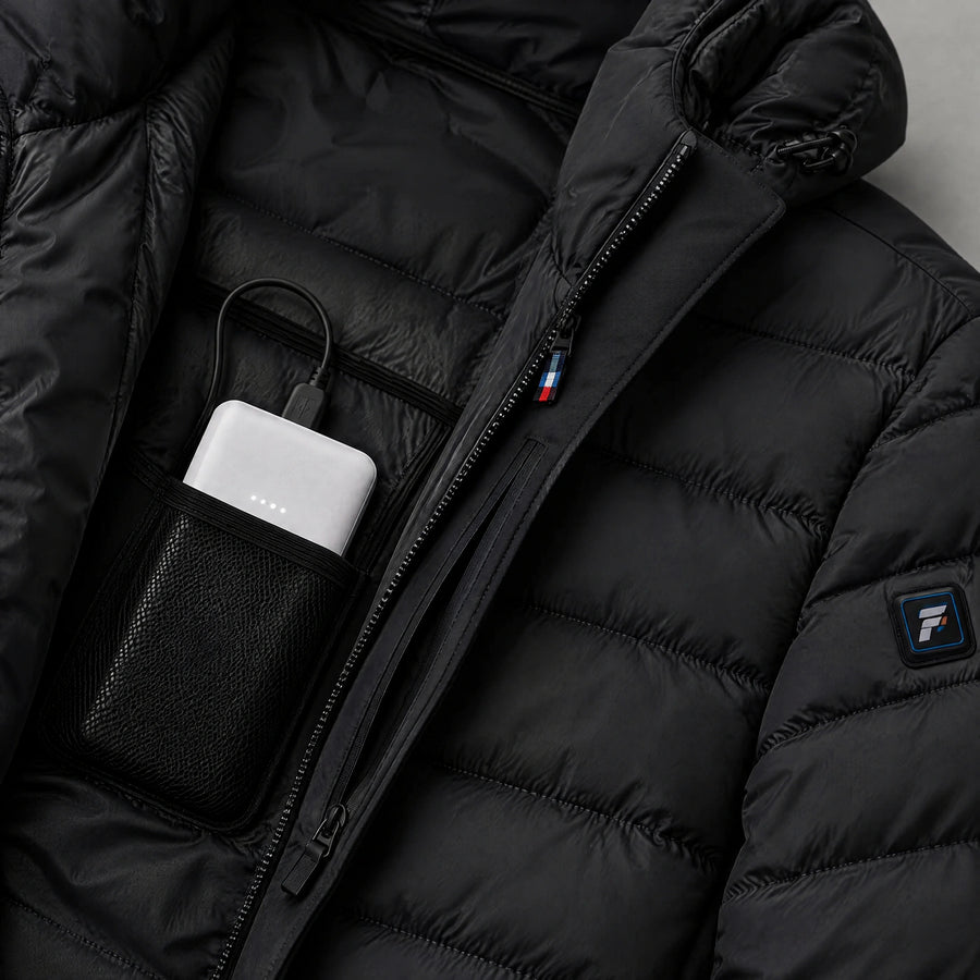 Battery placed in the inner pocket of a QUILLMORE heated jacket
