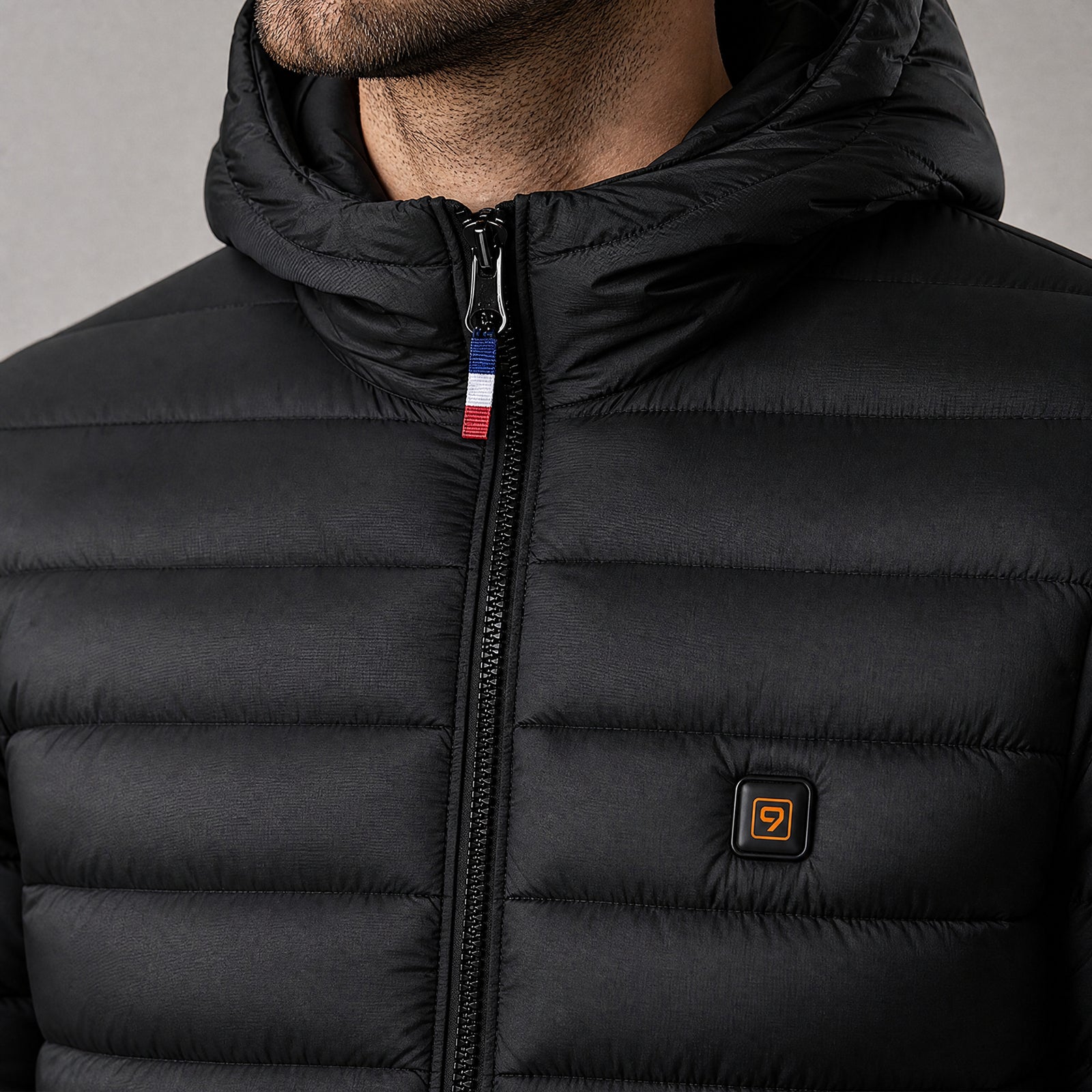 Control button on a QUILLMORE heated jacket