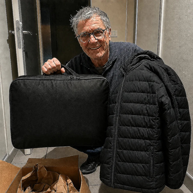 Male customer in his hallway with the QUILLMORE package and storage bag